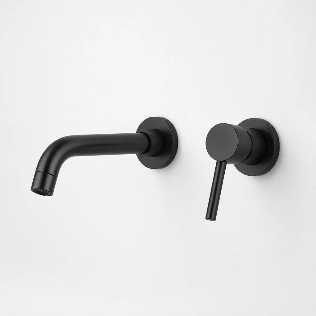 Robinet mural encastré noir mat avec bec arrondi et poignée levier moderne pour salle de bain design élégante.