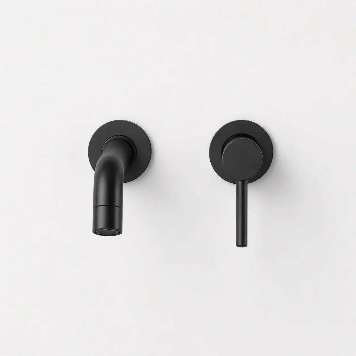 Robinet mural noir mat avec bec court arrondi et commande minimaliste pour lavabo moderne et élégant.